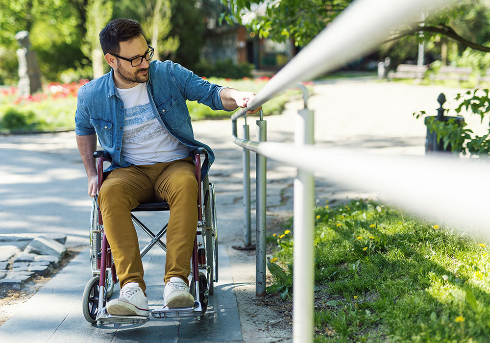 a man going into work in his wheelchair